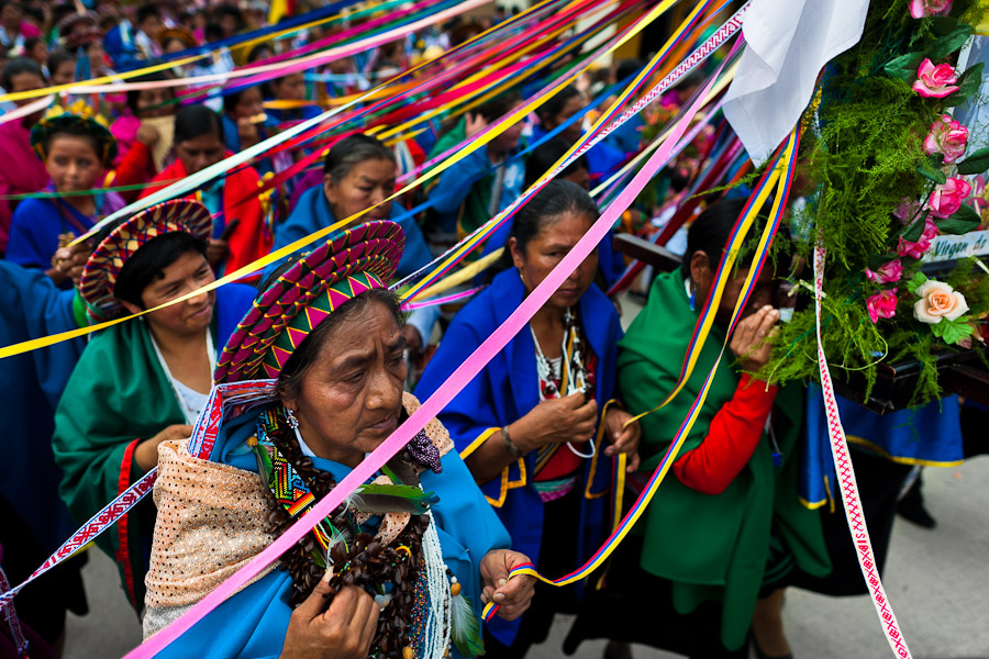 Native women from the Kamentsá tribe, wearing colorful costumes, take part in the procession during the Carnival of Forgiveness, a traditional indigenous celebration in Sibundoy, Colombia.