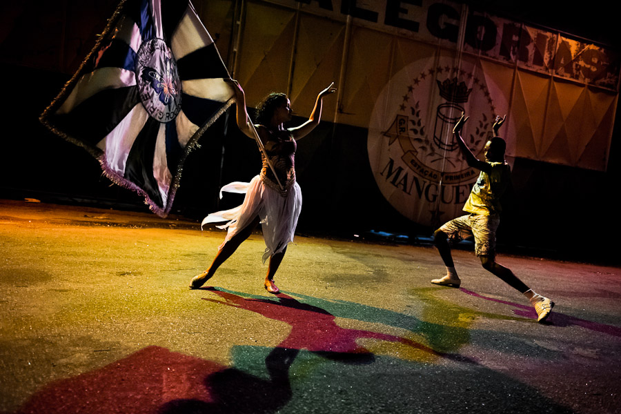 Rocinha samba school dancers, mestre-sala (the master dancer) and porta-bandeira (the flag bearer lady), rehearse their Carnival dance act in front of the school's workshop in Rio de Janeiro, Brazil.