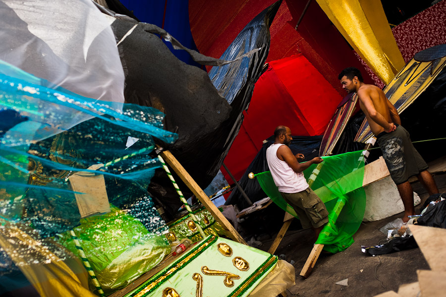 Members of a samba school work on a carnival float inside the workshop in Rio de Janeiro, Brazil.