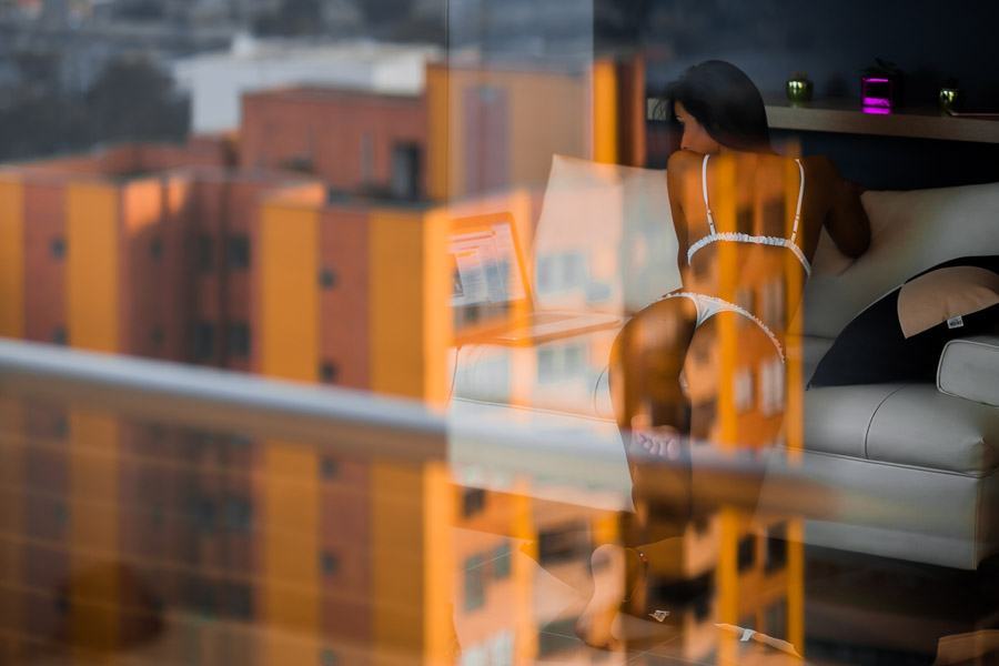 A Colombian webcam model, known as Caro Ortiz, performs a live erotic show during a webcam video broadcast from her apartment in Medellín, Colombia.