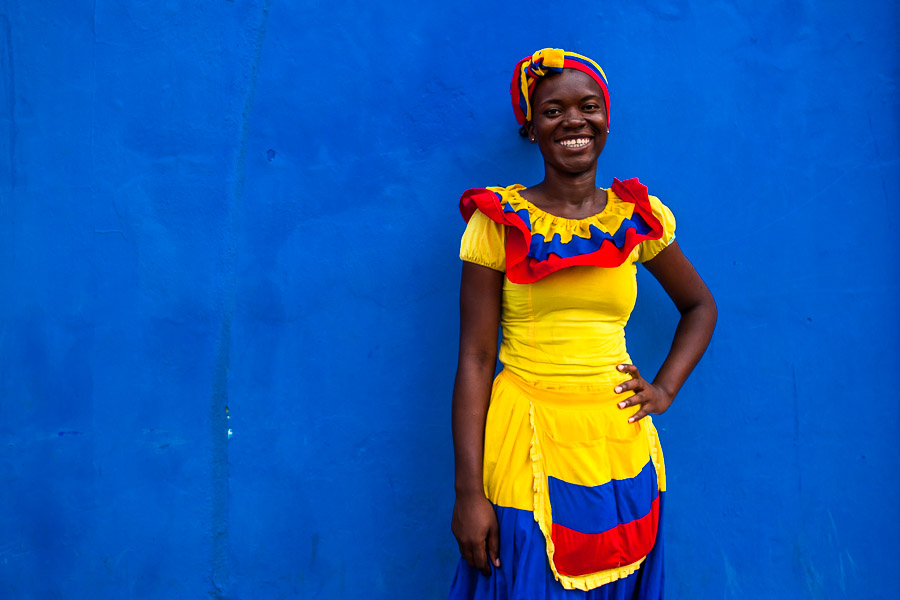 An Afro-Colombian girl, dressed in the traditional ‘palenquera’ costume, poses for a picture in walled city of Cartagena, Colombia.