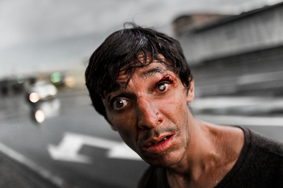 A Colombian partially blind (cataract) man poses for a picture in the center of Medellín, Colombia.