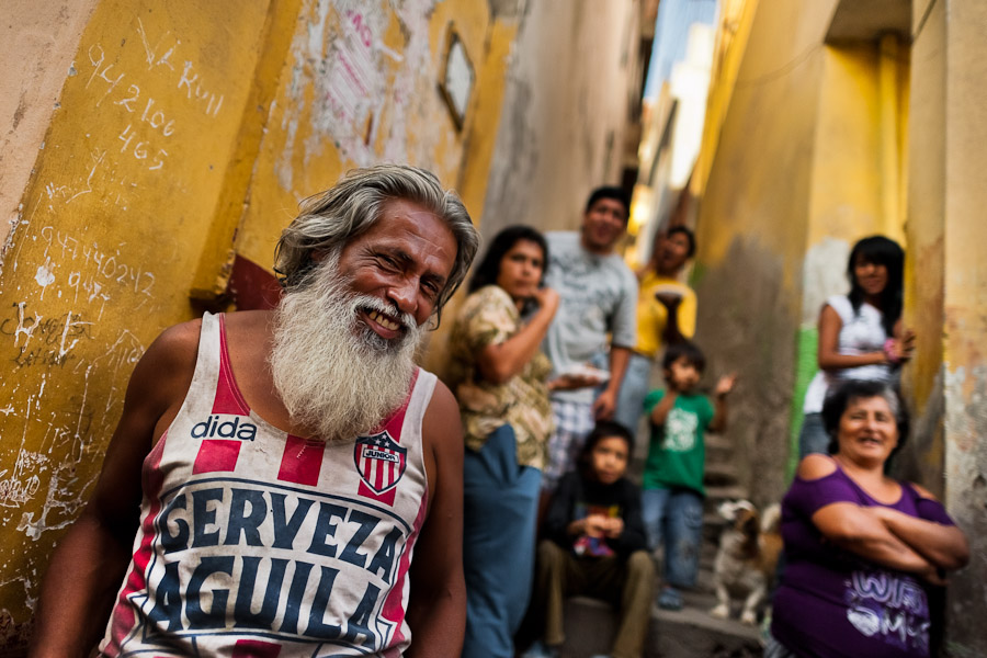 Catholic followers watch the Good Friday procession on the hill of San Cristobal during the Holy week in Lima, Peru.