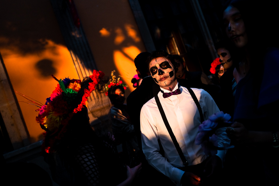 A young Mexican man, dressed as Catrín, a Mexican pop culture character representing the Death, takes part in the Day of the Dead festivities in Morelia, Michoacán, Mexico.