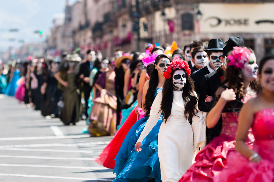Young couples, costumed as ‘La Catrina’, a Mexican pop culture icon representing the Death, walk through the town during the Day of the Dead festivities in Morelia, Michoacán, Mexico.