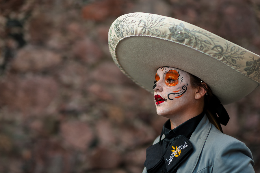 A Mexican girl, dressed as La Catrina and wearing a Mariachi sombrero hat, takes part in the Day of the Dead celebrations in Taxco de Alarcón, Guerrero, Mexico.
