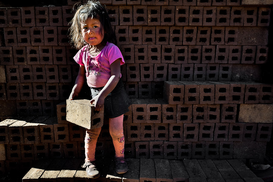 Child workers work at a brick factory in the outskirts of Puno, Peru.