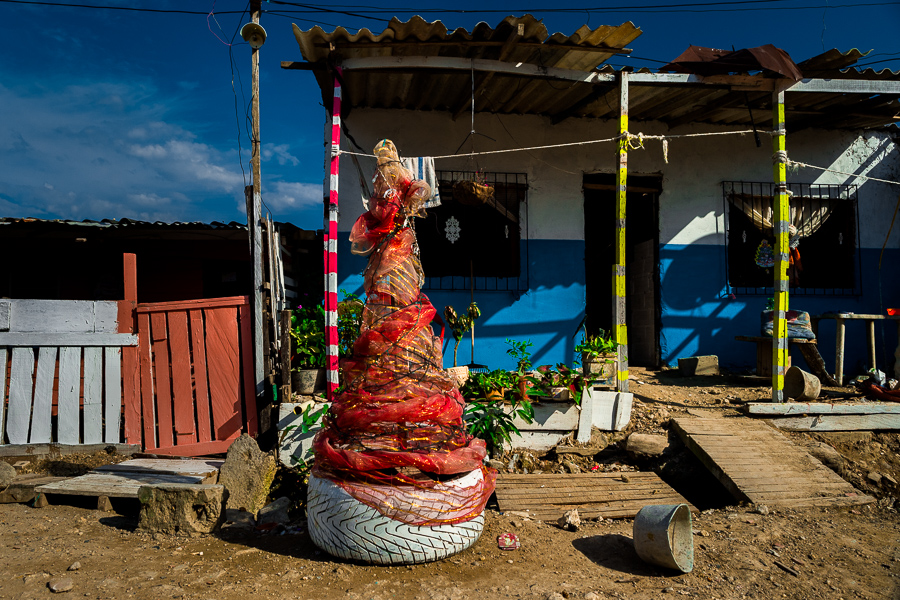 A Christmas tree, made of recycled materials and cheap decorative fabrics, is seen in a lower social class neighborhood in Cartagena, Colombia.