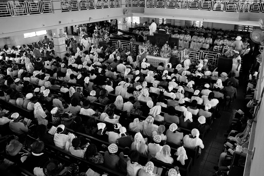 A Catholic reverend leads the Sunday mass in the overcrowded church in Delmas, Port-au-Prince, Haiti.