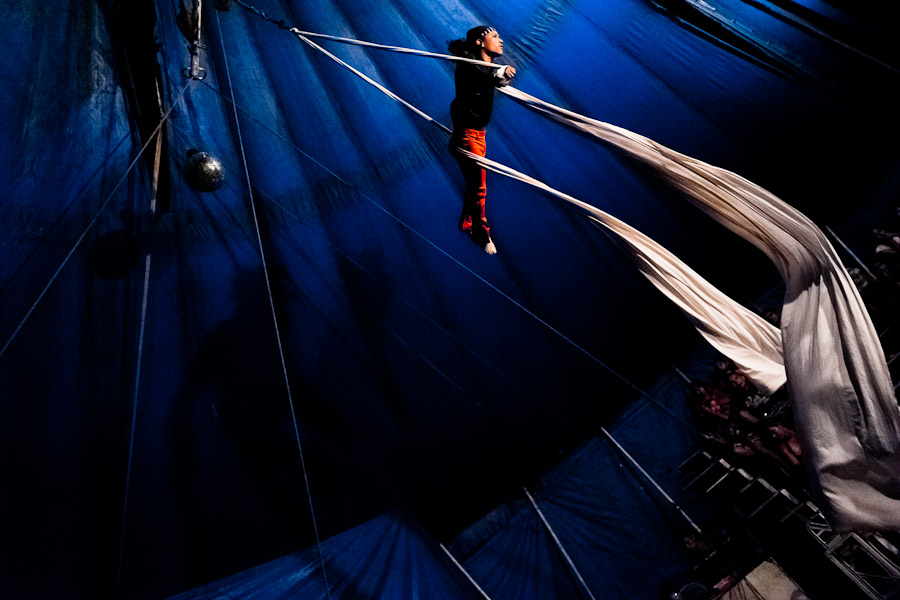 A Salvadorean man performs an aerial fabric acrobatics act at the Circo Brasilia, a family run circus travelling in Central America.
