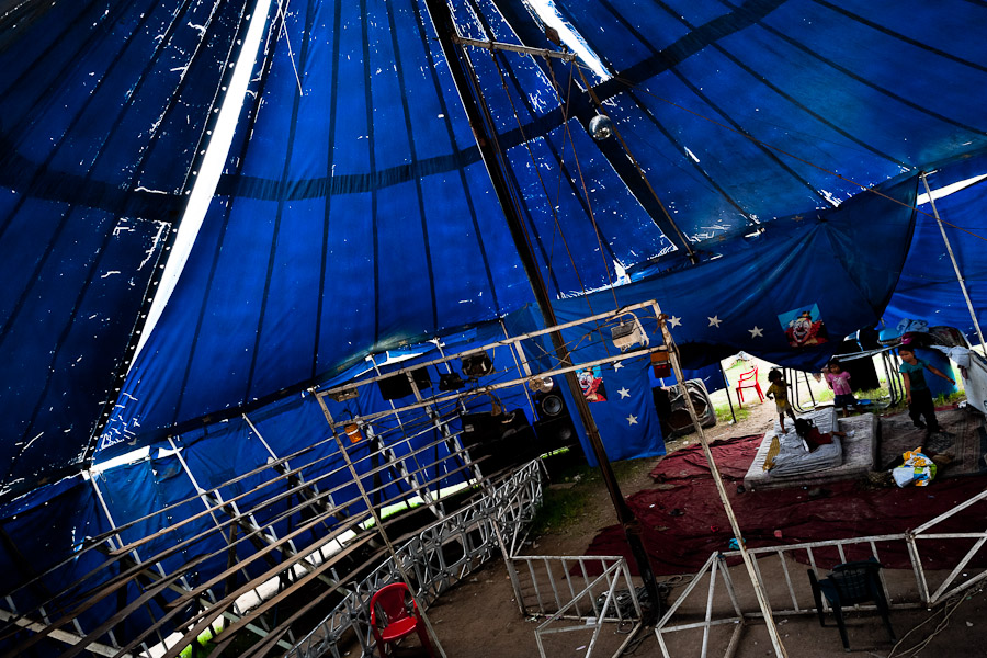 Salvadorean children play in the empty tent of the Circo Brasilia, a family run circus travelling in Central America.