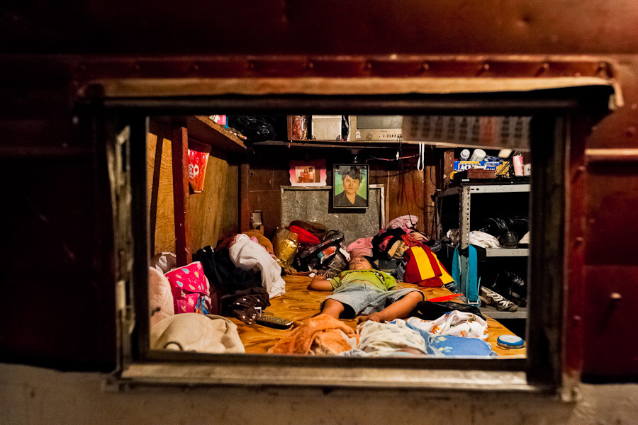 A Salvadorean boy sleeps in the trailer belonged to the Circo Brasilia, a family run circus travelling in Central America.