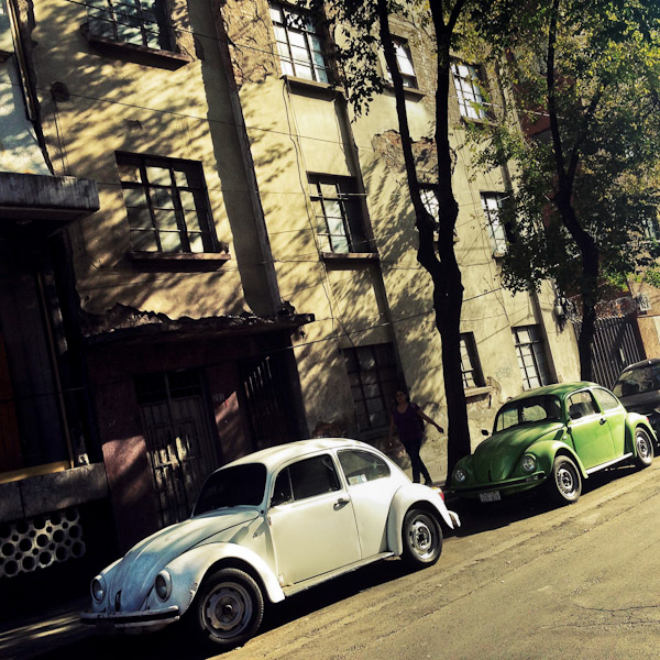 Classic Volkswagen beetle cars (‘vochos’) are seen parked on the street in Mexico City, Mexico.