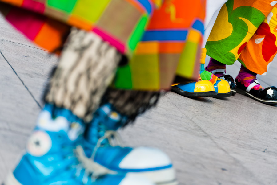 Clowns wear oversized colorful shoes during the Clown Congress.