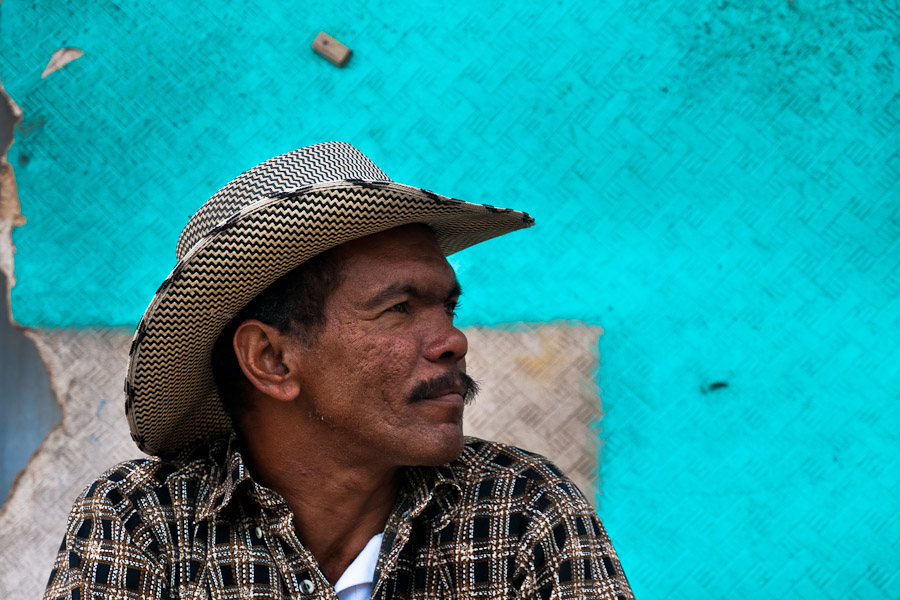 A Colombian cowboy sits in front of his house, Bogota.