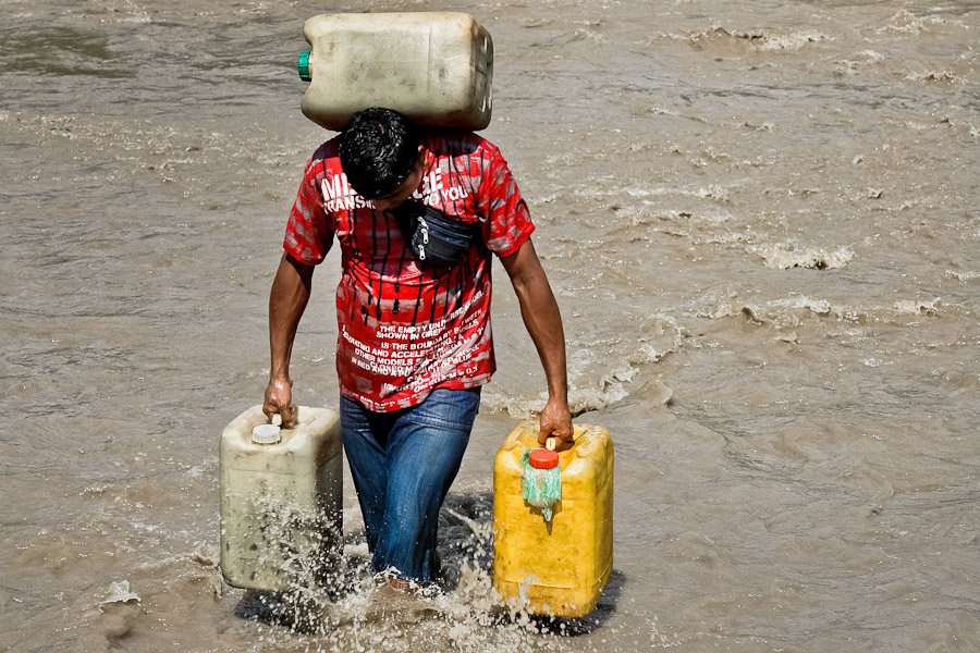 A small gasoline smuggler crew can make up to three or four round trips in a day if they are not caught and the river is not very wild. It brings about 5-8 USD to each crew member per day.