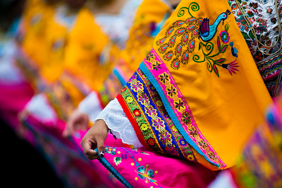 Woman dancers (danzantes) perform in the religious parade within the Corpus Christi festival in Pujilí, Ecuador.