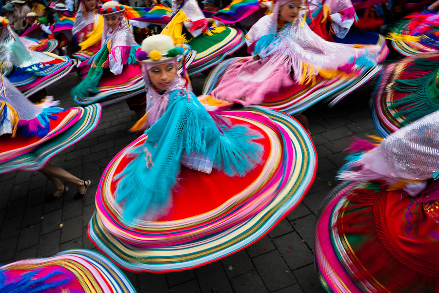 Woman dancers (danzantes) perform in the religious parade within the Corpus Christi festival in Pujilí, Ecuador.