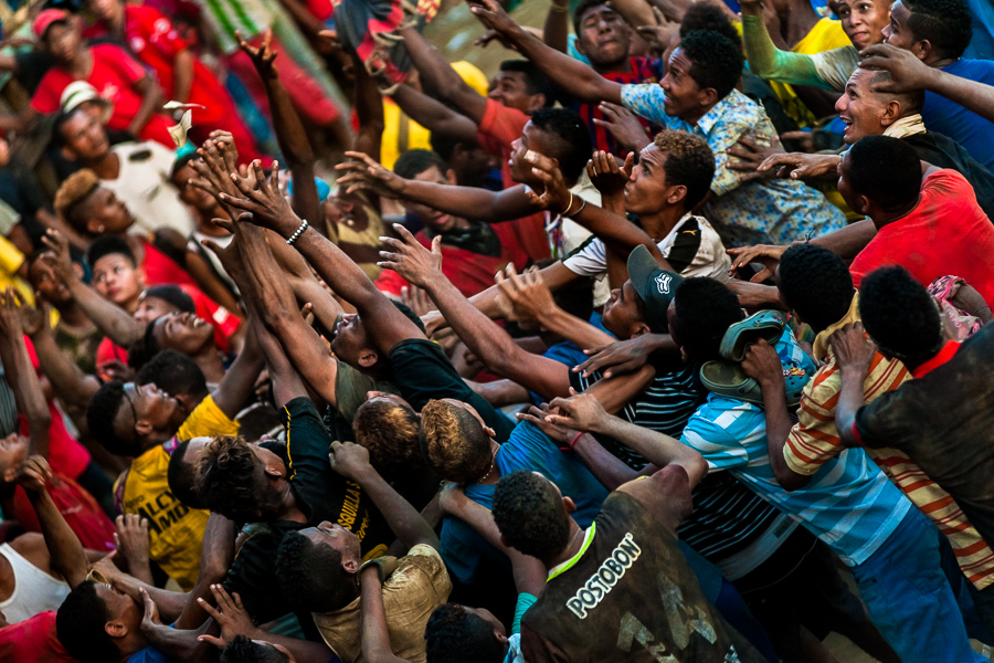 Colombian amateur bullfighters fight over money thrown by spectators into the arena of Corralejas, a rural bullfighting festival held in Soplaviento, Colombia.