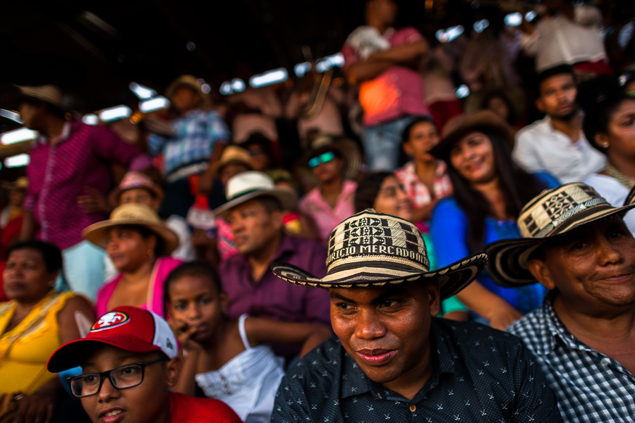 Colombian peasants, sitting on the bleachers, watch an amateur bullfight in the arena of Corralejas, a rural bullfighting festival held in Soplaviento, Colombia.