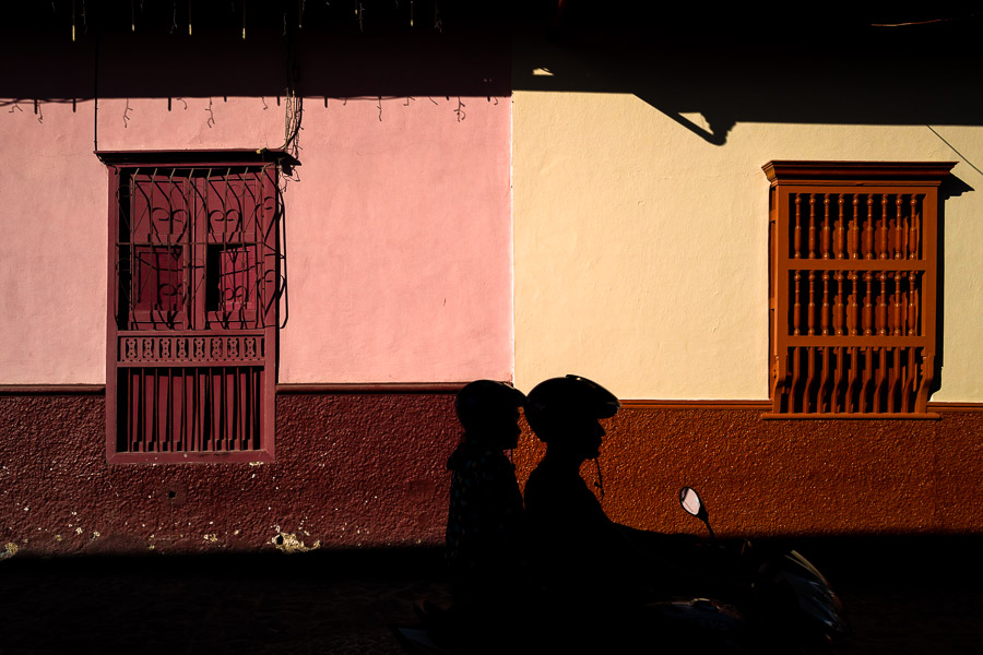 A Colombian couple ride a motorbike in Sonsón, a mountain village in the coffee region of Colombia.