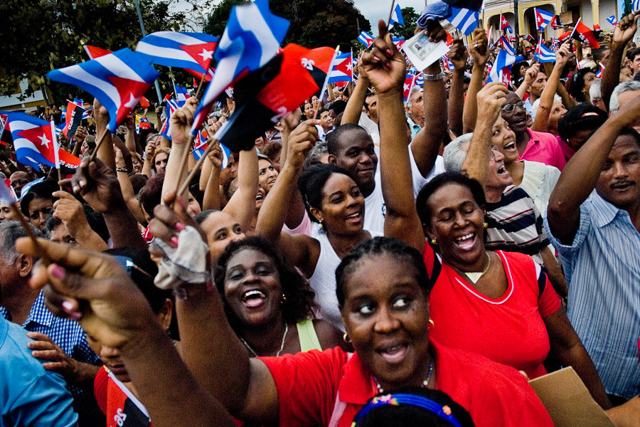 Hundreds of Cubans wave the national flags, expressing support for the regime of Fidel Castro and his brother Raul Castro during the annual celebration of the Cuban Revolution's beginning.