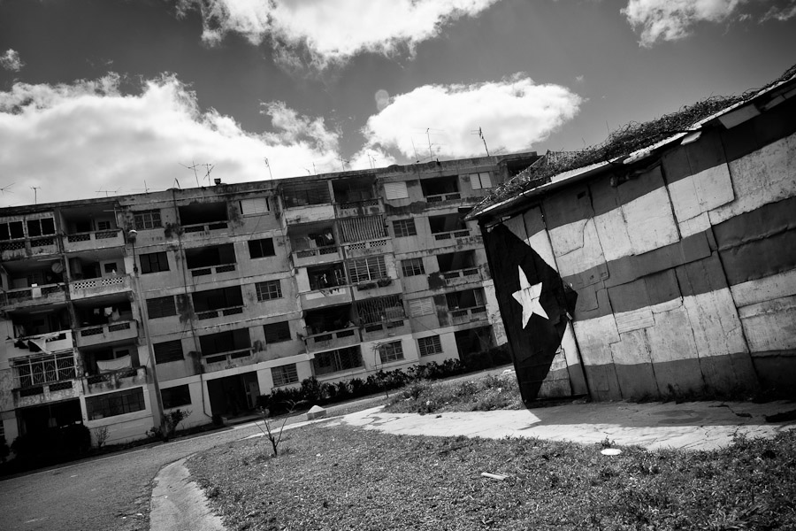 A Cuban national flag painted on a shack in Alamar, a huge public housing complex in the Eastern Havana, Cuba.