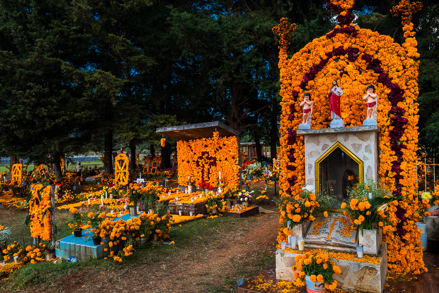 Graves decorated with marigold flowers are seen at a cemetery during the Day of the Dead festivities in Cucuchucho, Michoacán, Mexico.