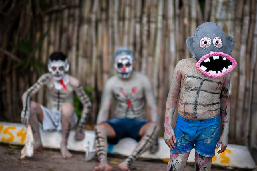 Salvadoran boys, painted an ashen grey and wearing masks, perform indigenous mythology characters in the La Calabiuza parade at the Day of the Dead celebration in Tonacatepeque, El Salvador.