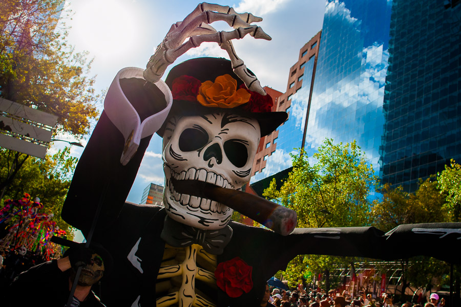 A gigantic Calaca figure, a Mexican icon representing the deceased, is carried on the street during the Day of the Dead parade in Mexico City, Mexico.