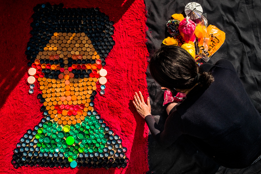 A Mexican female artist creates a portrait picture of the Mexican painter Frida Kahlo during the Day of the Dead celebrations in Taxco de Alarcón, Mexico.