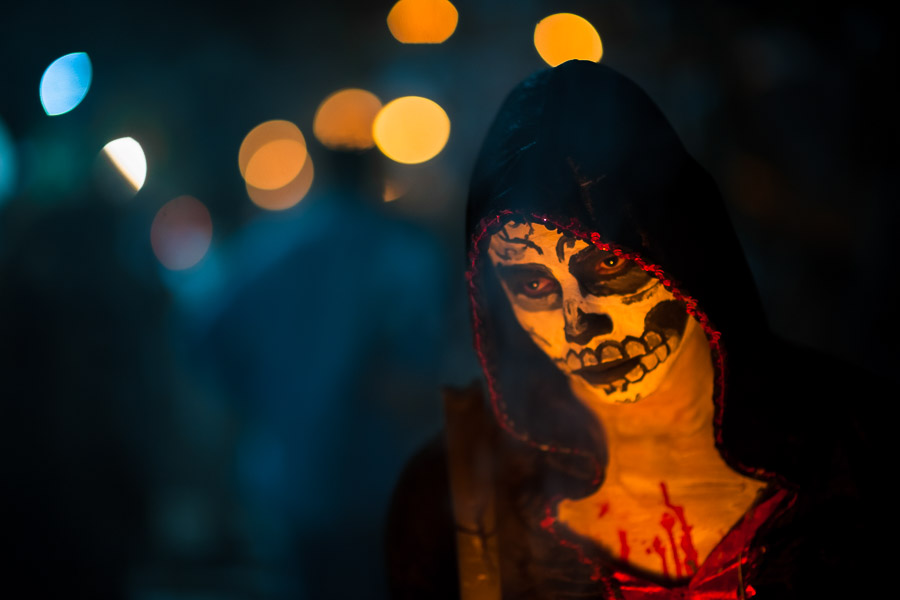 A Salvadoran girl with skull face paint takes part in the La Calabiuza parade at the Day of the Dead festivity in Tonacatepeque, El Salvador.