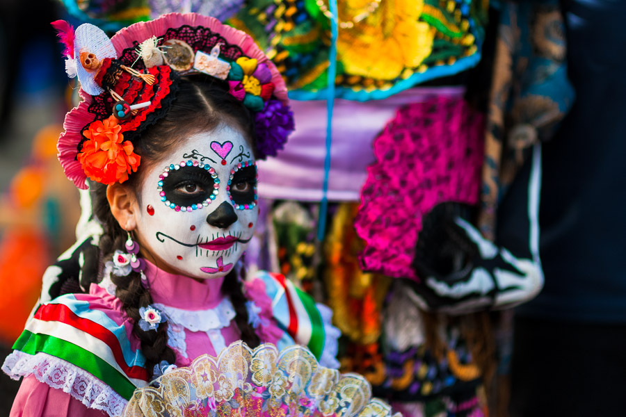 A young girl, dressed as La Catrina, a Mexican pop culture icon representing the Death, takes part in the Day of the Dead festivities in Mexico City, Mexico.