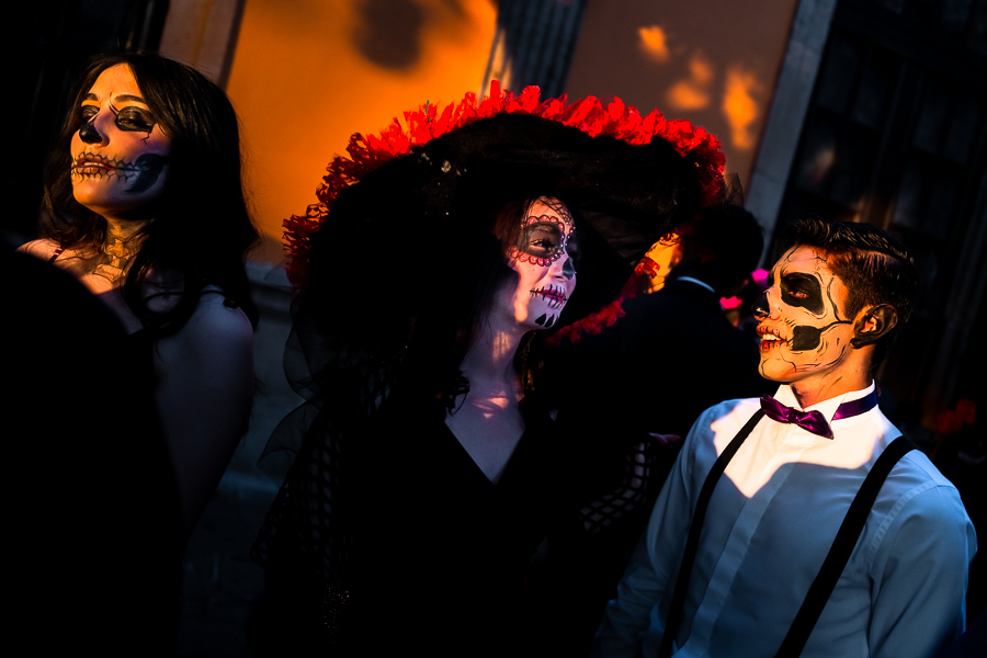 Young Mexican women, dressed as La Catrina, and a young Mexican man, dressed as Catrín, take part in the Day of the Dead festivities in Morelia, Michoacán, Mexico.