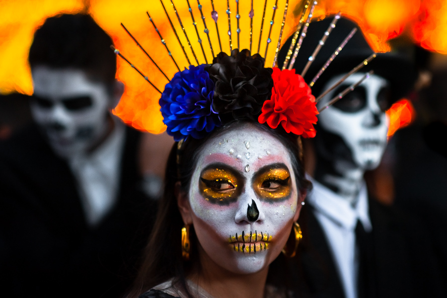 A young Mexican woman, dressed as La Catrina, and young Mexican men, dressed as Catrín, take part in the Day of the Dead festivities in Morelia, Michoacán, Mexico.