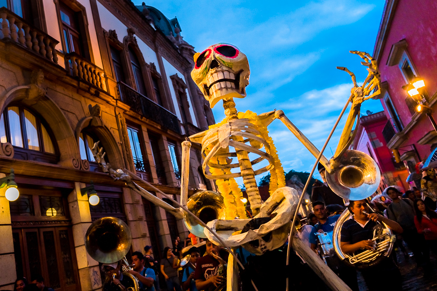 A giant Calaca figure, a Mexican icon representing the deceased, is carried on the street during the Day of the Dead celebrations in Oaxaca, Mexico.