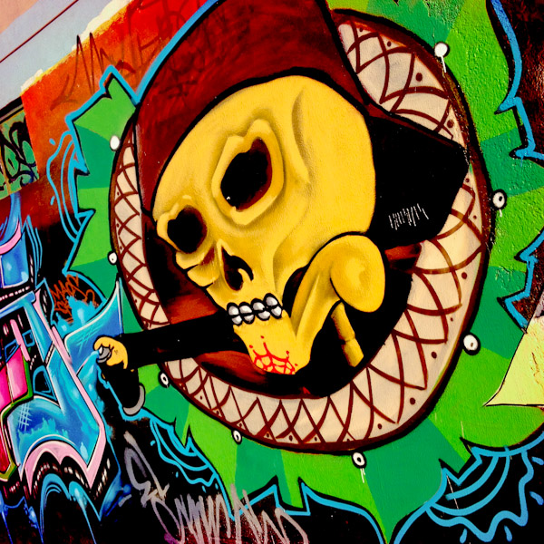 A skull graffiti artwork, illustrating the extensive Death worship culture in Mexico, appears on the wall in Morelia, Michoacán, Mexico.