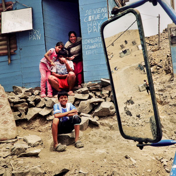 Pachacútec, a desert shantytown in Lima (Peru) seen from the window of a water distribution truck.