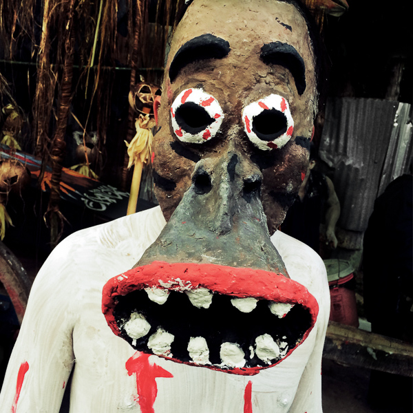 Salvadoran young people, wearing home made masks, take part in an annual festivity of Día de la Calabiuza in Tonacatepeque, El Salvador.