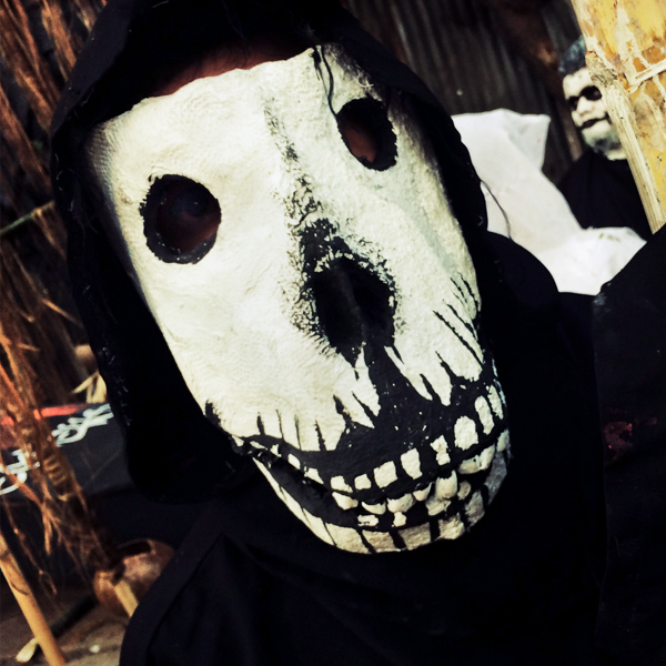 A Salvadoran boy, wearing a home made mask, takes part in an annual festivity of Día de la Calabiuza in Tonacatepeque, El Salvador.