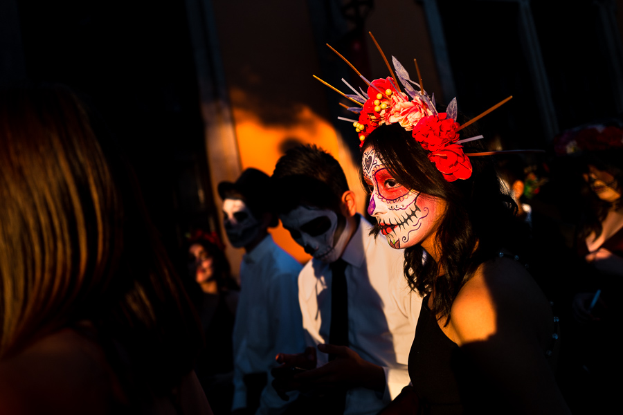 A young Mexican woman, dressed as La Catrina, and young Mexican men, dressed as Catrín, take part in the Day of the Dead celebrations in Morelia, Michoacán, Mexico.