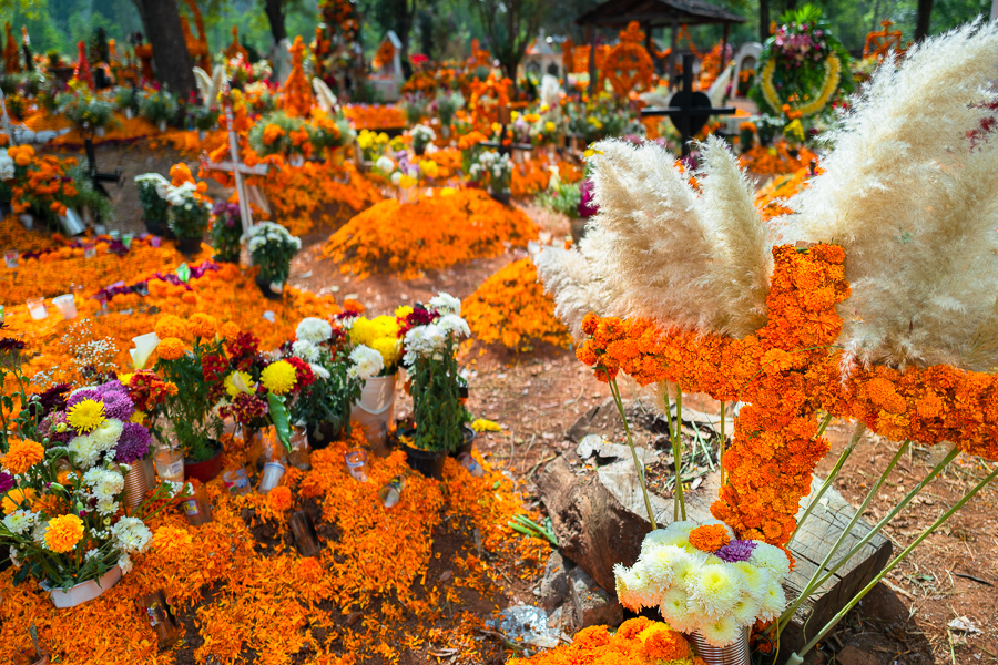 Graves decorated with marigold flowers are seen at a cemetery during the Day of the Dead celebrations in Tzurumútaro, Michoacán, Mexico.
