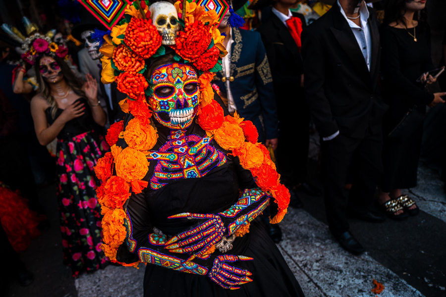 A Mexican woman, dressed as La Catrina and wearing Huichol beaded mask and dress, takes part in the Day of the Dead festivities in Morelia, Michoacán, Mexico.