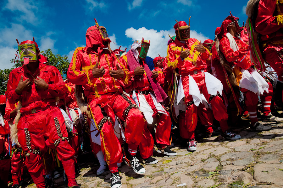 The group of the Devils (Diablos) represent the Evil. They roughly trample down, they shout and jingle with hundreds of little bells tied up to their legs. They laugh at God.