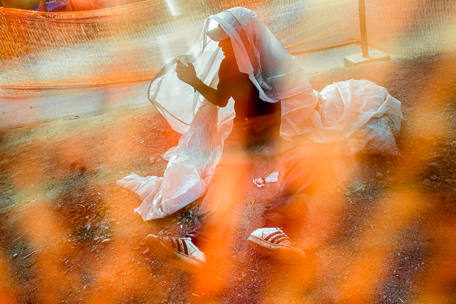 A Colombian man is seen during a heavy drug intoxication after smoking a pipe of “bazuco” (a raw cocaine paste) in Medellín, Colombia.