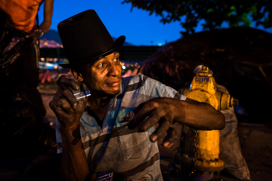 A young Colombian man is seen while receiving the “first kick” after having smoked a heavy dose of “bazuco” (a raw cocaine paste) on the street in Medellín, Colombia.