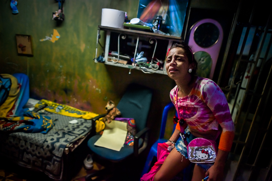 A Colombian drug consumer cries after going through a street fight in “Bronx”, a drug distribution area in the center of Medellín, Colombia.