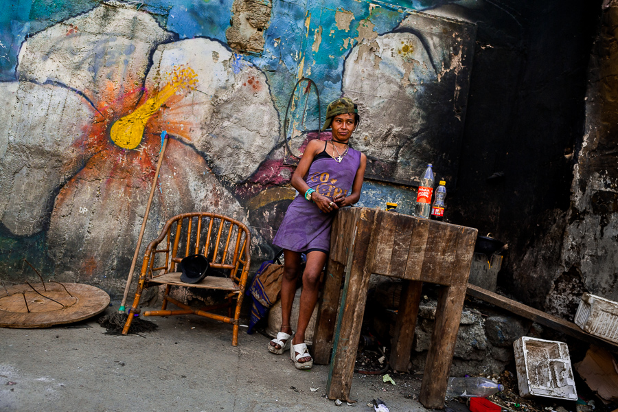 A young Colombian woman smokes “basuco” (a raw cocaine paste) in the street of “El Bronx” in Medellín, Colombia.