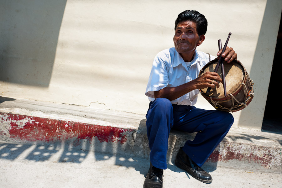 A Salvadoran man plays a drum during the procession of the Flower & Palm Festival in Panchimalco, El Salvador.