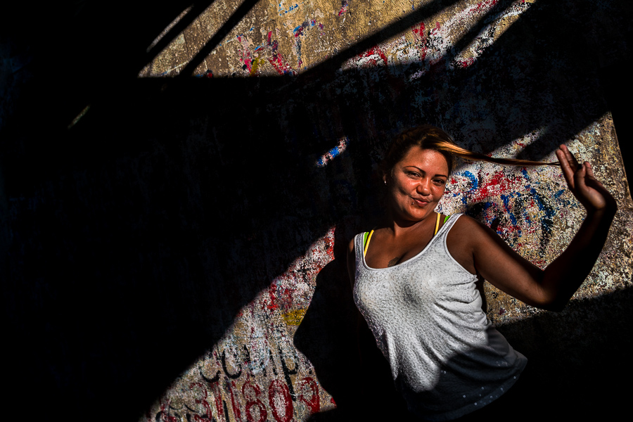 A Venezuelan girl, an economic/political migrant from Caracas, poses for a picture in the market of Bazurto in Cartagena, Colombia.